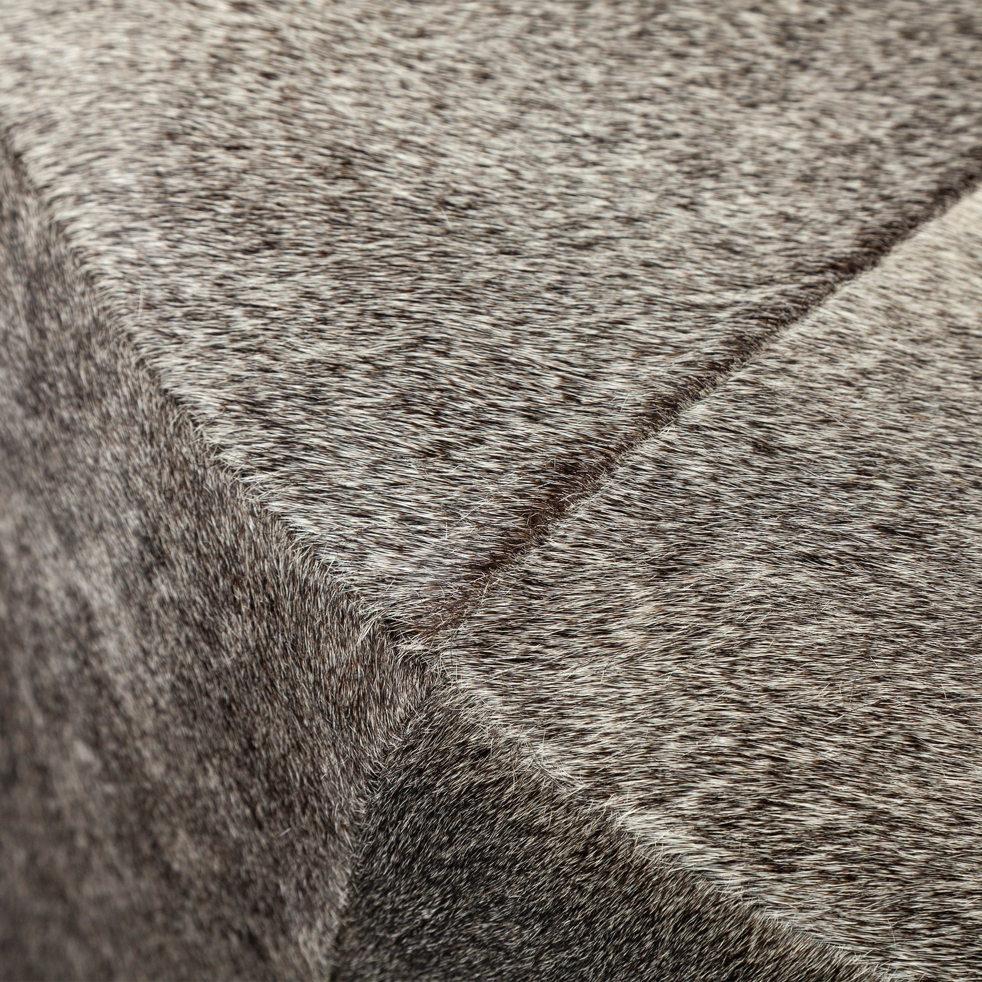 Zahavi I 23"H grey - toned hair - on - hide ottoman - Central Designs